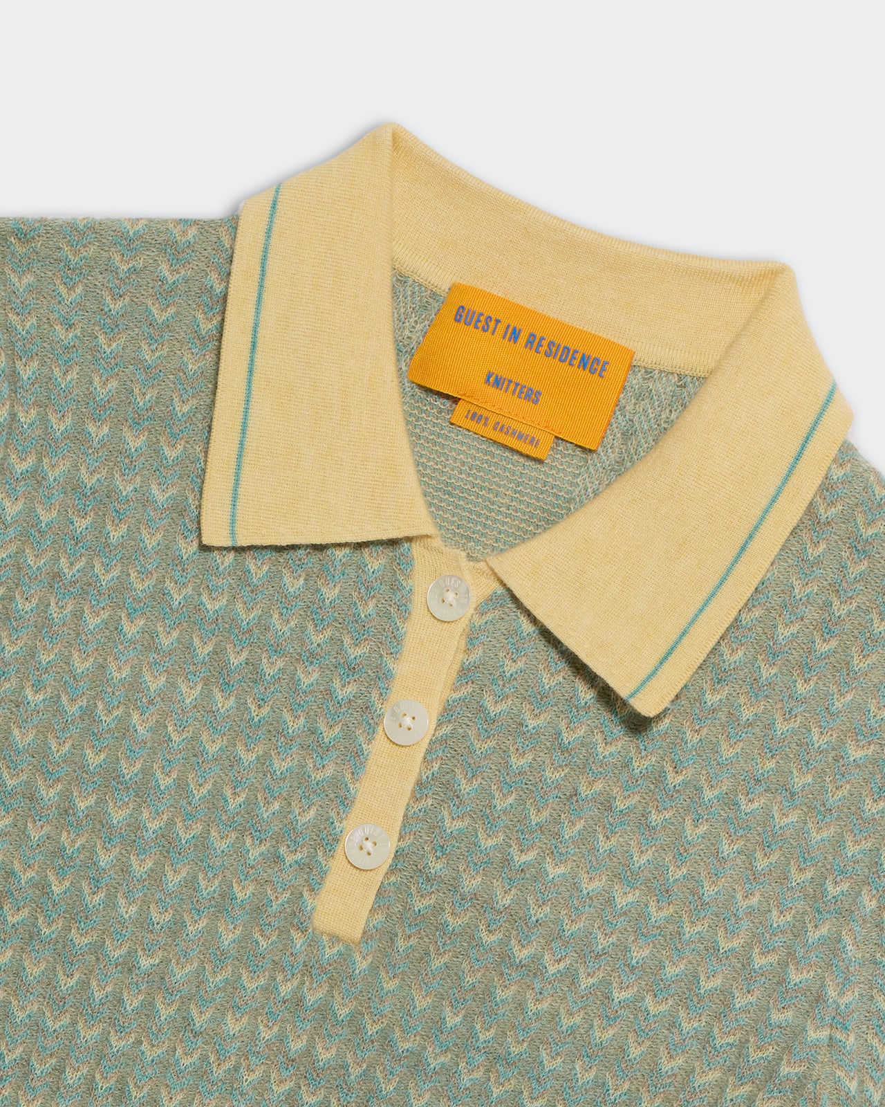 Close-up of Chevron L/S Shrunken Polo Butter Combo showing textured knit pattern and buttoned collar.