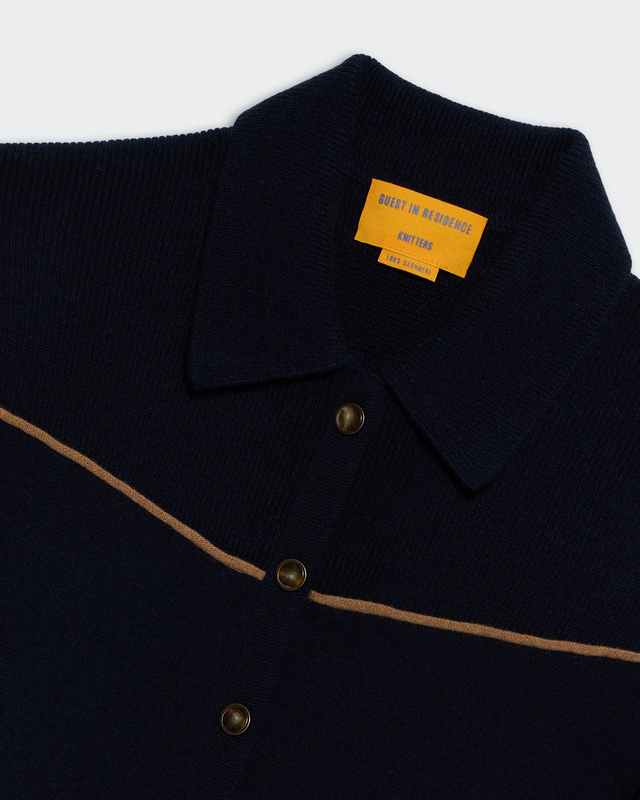 Western Everywear Coverall - Midnight cashmere jumpsuit with rib stitch collar and horn-style buttons detail close-up