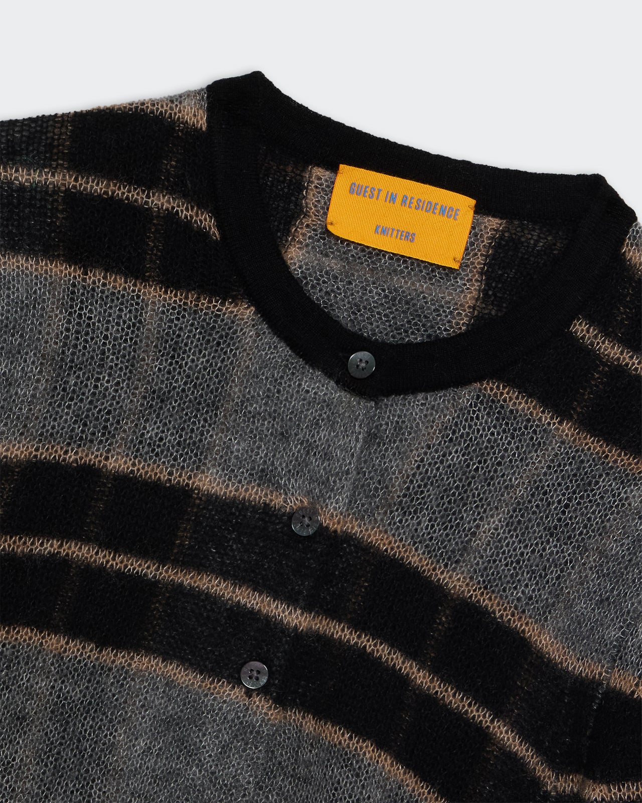 Shadow Plaid Cardigan - Black Combo showing soft double-layered knit plaid pattern with black ribbed trim and buttons.