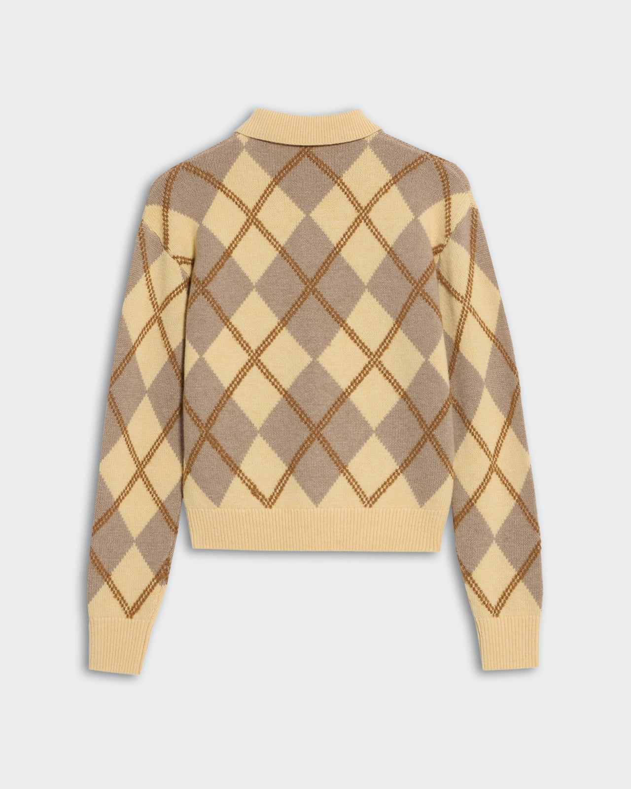 Collegiate Argyle Polo Butter Combo with classic argyle pattern in beige and butter yellow, long sleeves, and ribbed cuffs.
