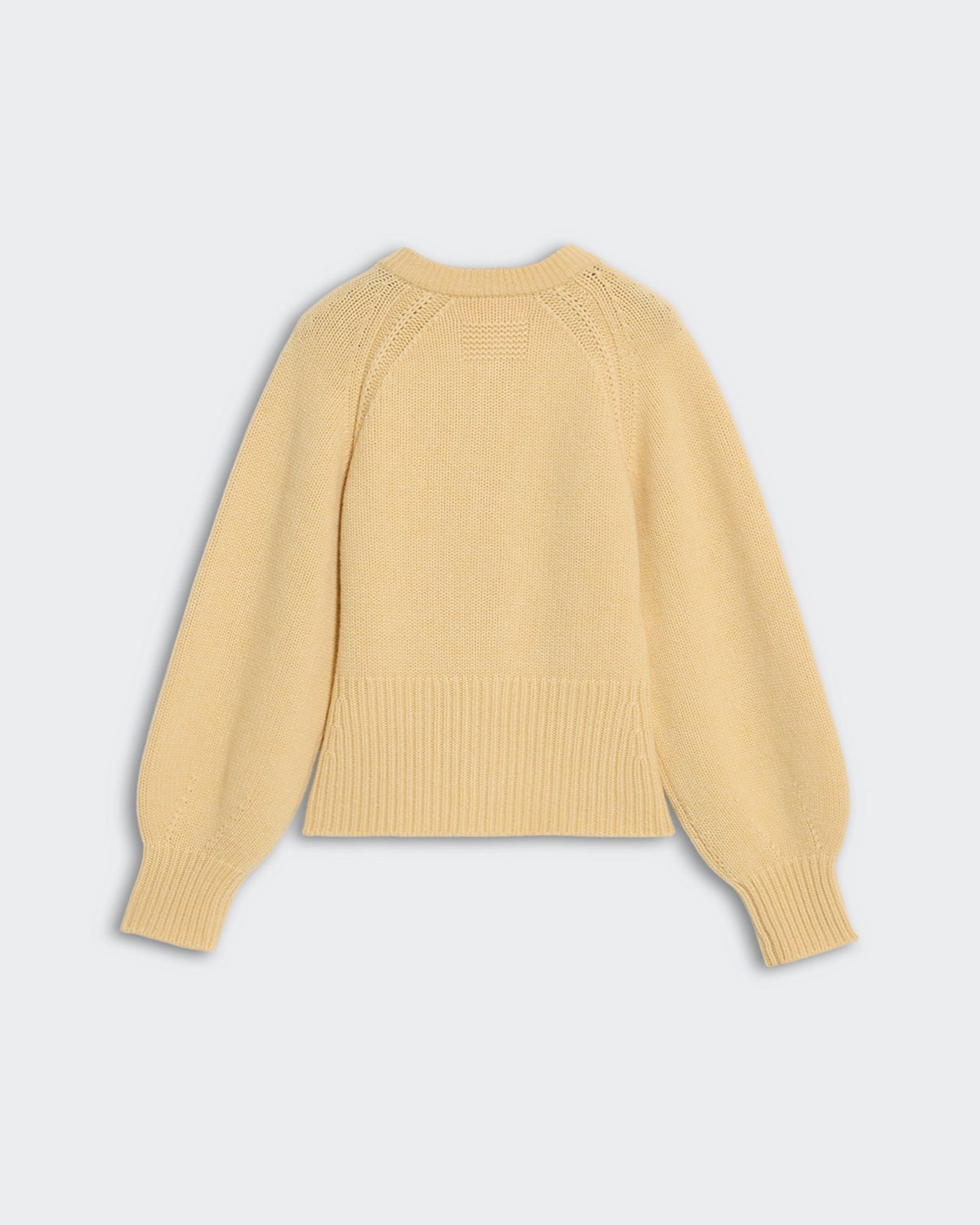 Sculpted Cardigan - Butter heavy-weight cropped cashmere sweater with puffed raglan sleeves and decorative tucking details.