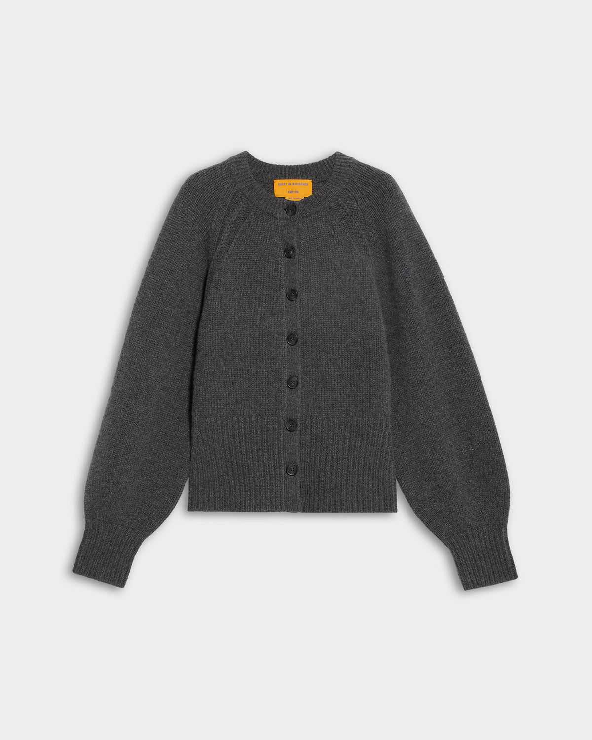 Sculpted Cardigan - Charcoal heavy-weight cropped cashmere with puffed raglan sleeves and front button closure.