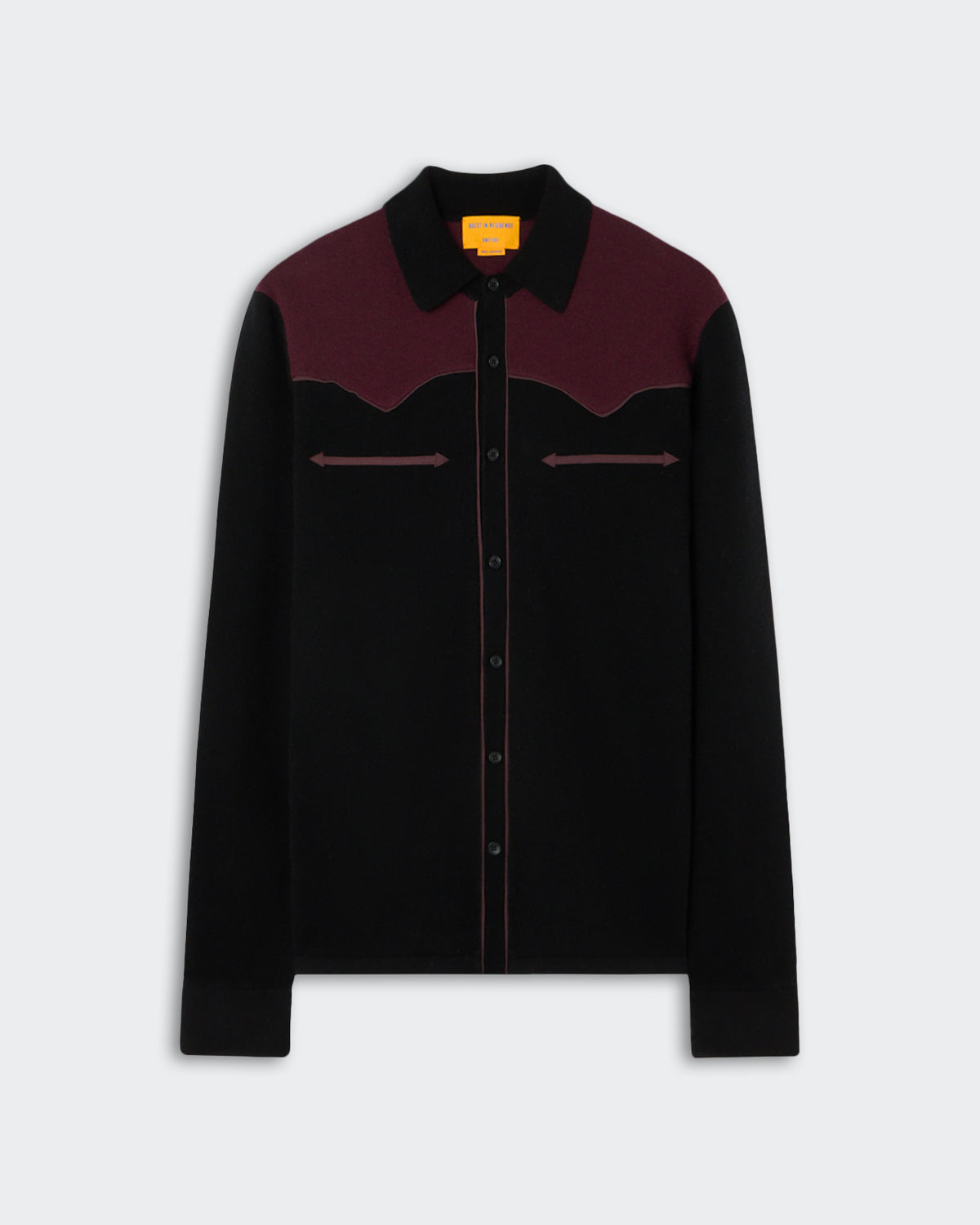 Long-sleeve black and dark burgundy shirt with a button-up front, a pointed collar, and decorative arrow-like stitching across the chest.