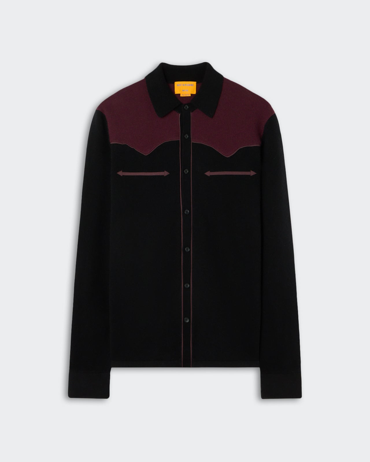 Long-sleeve black and dark burgundy shirt with a button-up front, a pointed collar, and decorative arrow-like stitching across the chest.