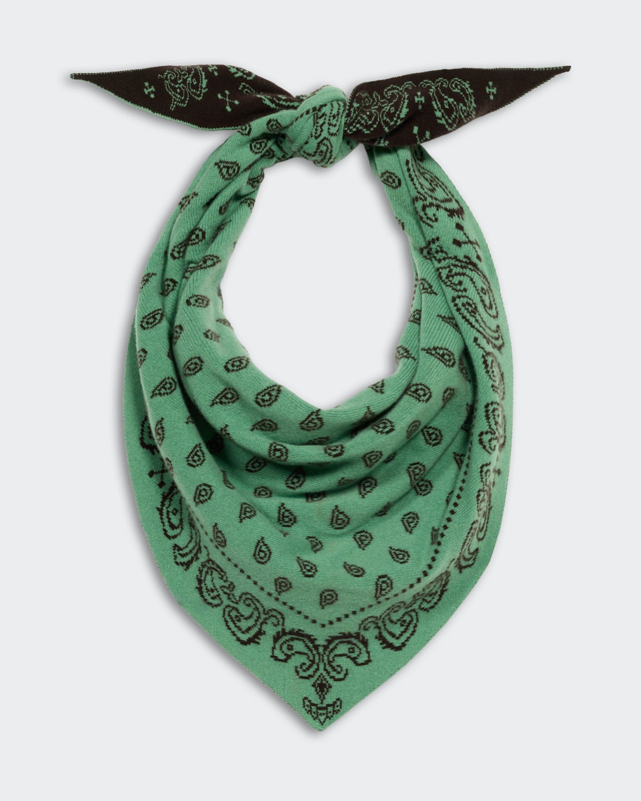 The Wild Rag - Highland/Burnt Cocoa cashmere scarf in green with black paisley pattern, styled with a knot and showcasing a soft, luxurious texture.