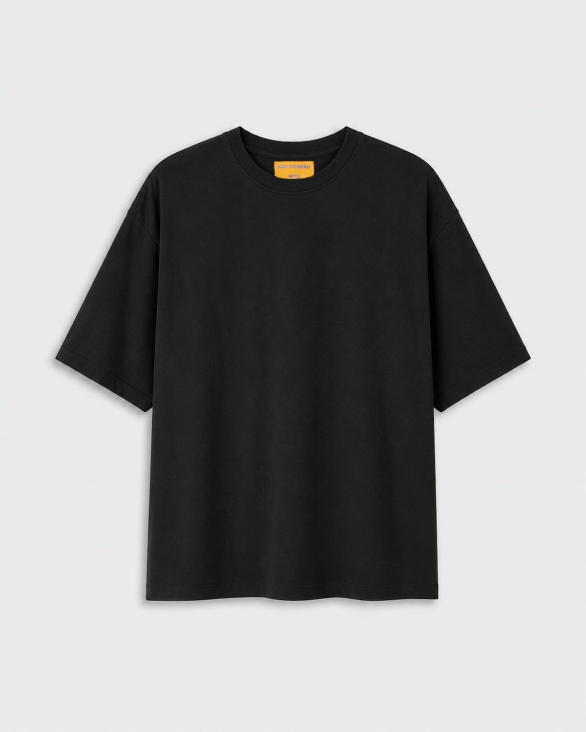 Oversized Tee - Black shown flat against a light background with a crew neckline short sleeves and relaxed oversized fit