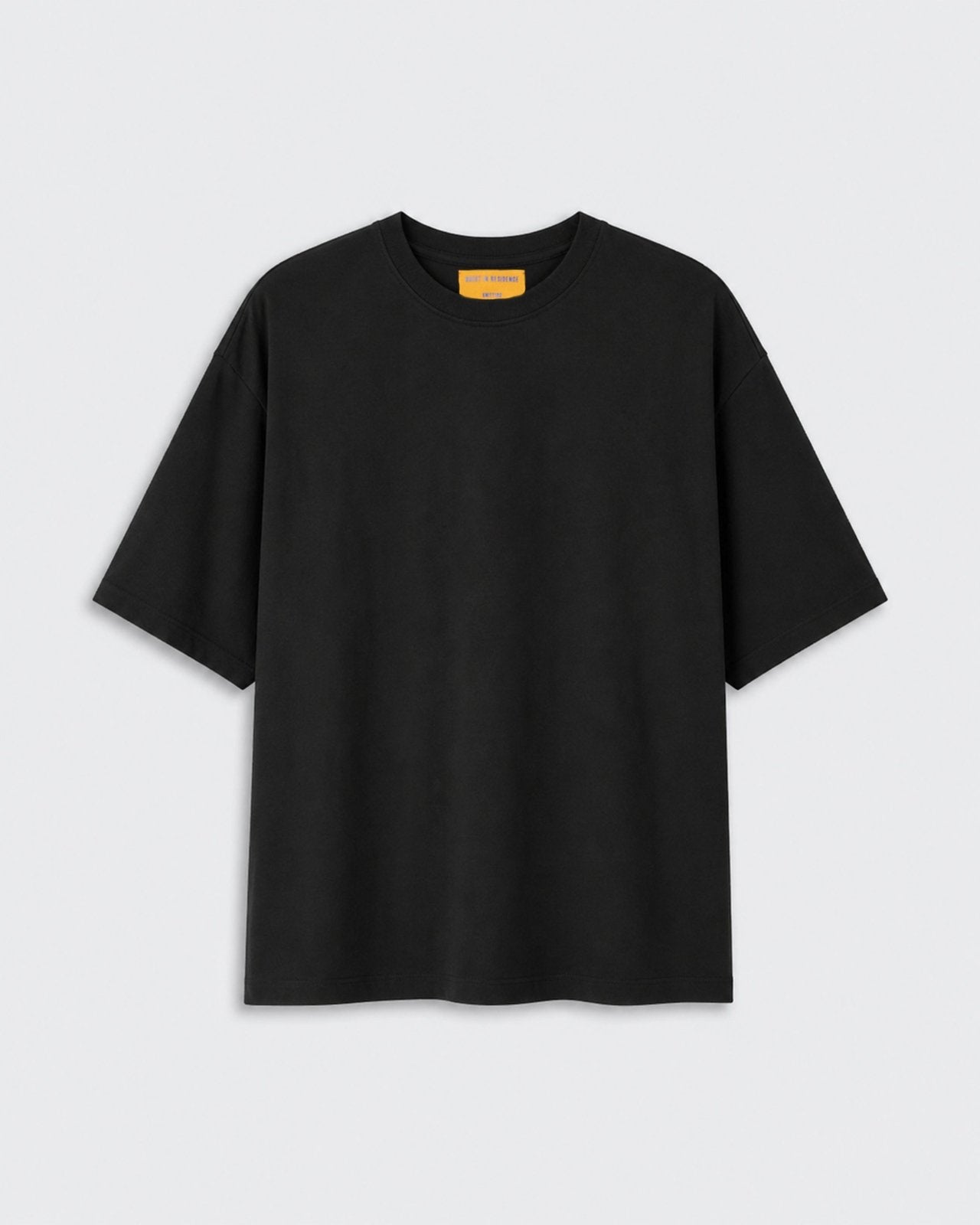 Oversized Tee - Black shown flat against a light background with a crew neckline short sleeves and relaxed oversized fit