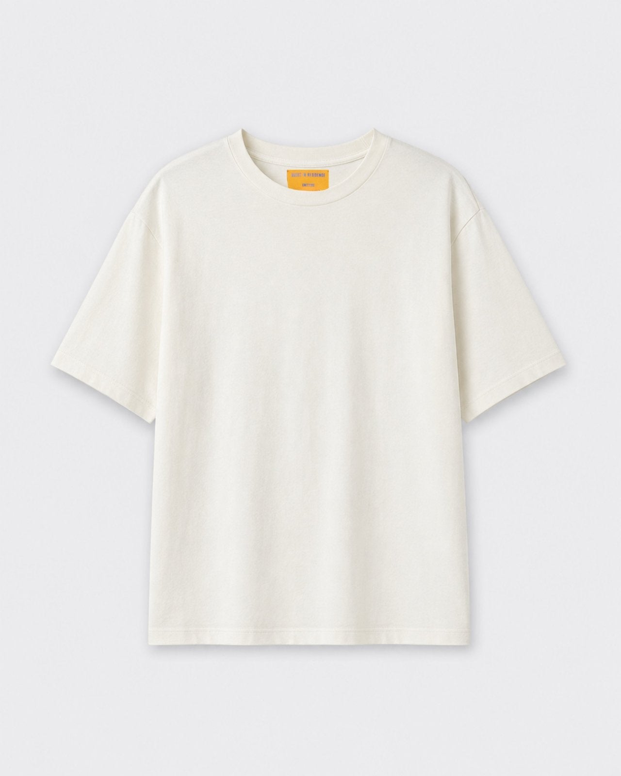 Oversized Tee - Cream laid flat on a light background with a relaxed fit short sleeves crew neck and clean minimal design